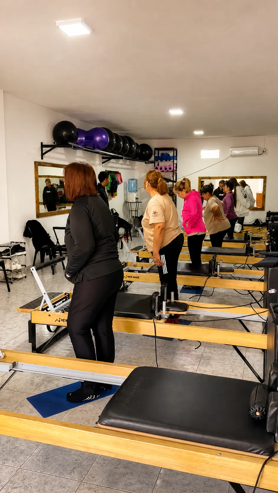 Clase grupal de Pilates mat